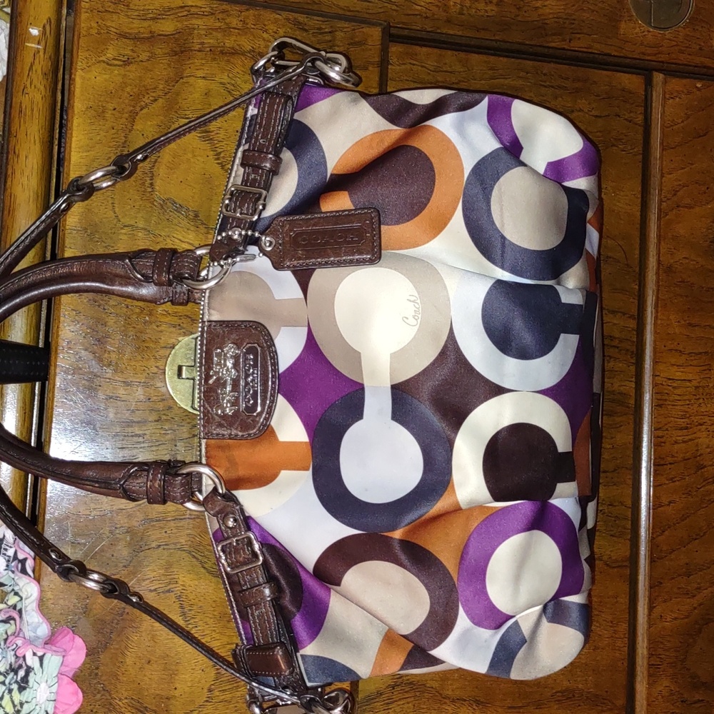 Coach Signature Color Block Purse with Shoulder strap and Purple interior.